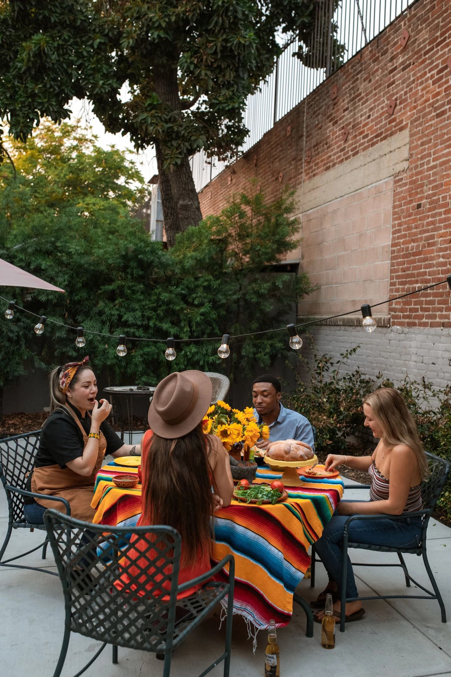 Friends sharing dinner on a garden patio