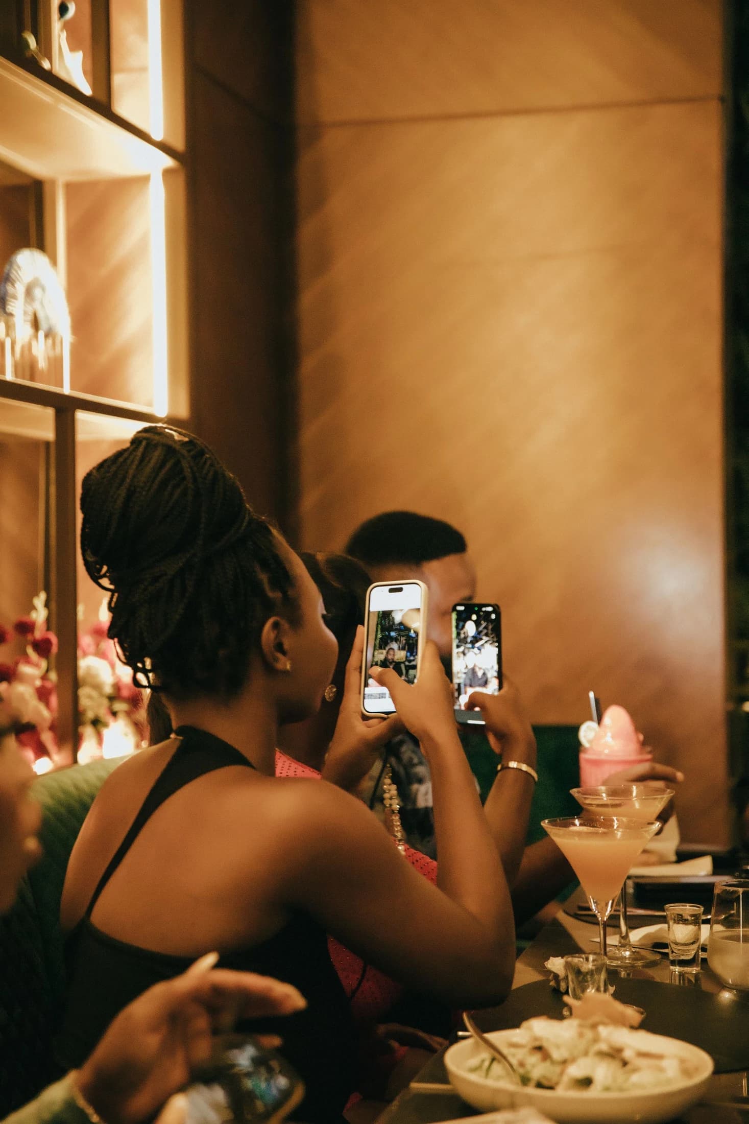 Diners filming their table on their phones